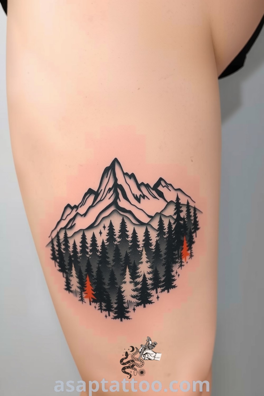 Sketch-style tattoo of mountains and a dense forest with intricate linework and shading, creating a striking design on light skin. A gorgeous, inspiring tattoo idea you must see to believe. asaptattoo.com