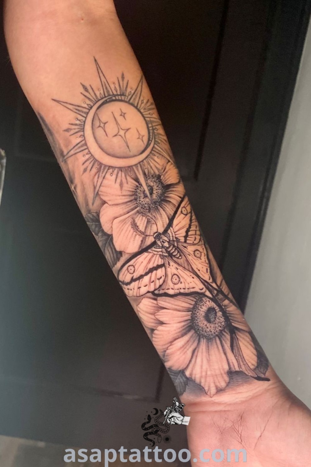 A person with a tattoo on their arm showcasing beautiful sun and moon designs, including Sun Moon Stars Sleeve Tattoo and Moth And Sun Tattoo. Perfect tattoo ideas for inspiration available at asaptattoo.com.