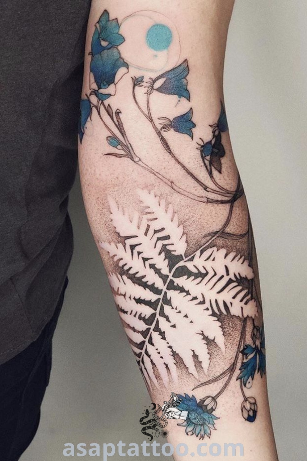 Stunning fern tattoo on the arm showcasing the "Love Fern Tattoo" design, embodying feminine forest aesthetics and negative space elements. A beautiful tattoo for nature lovers, discover more amazing ideas at asaptattoo.com.