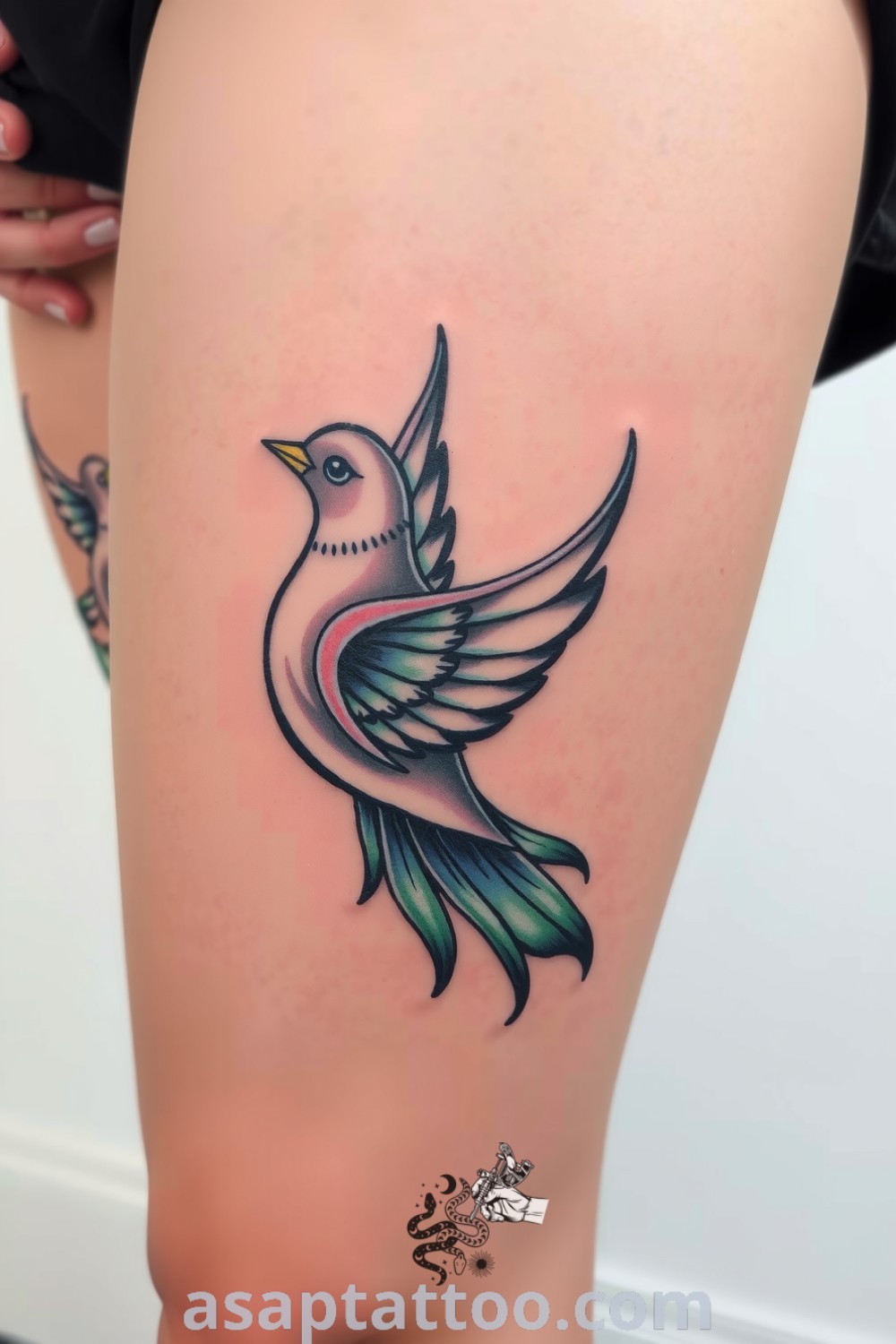 Art Nouveau bird tattoo with intricate linework and lush gradients of blue and green, symbolizing freedom and grace. A gorgeous tattoo idea you must see to believe. asaptattoo.com