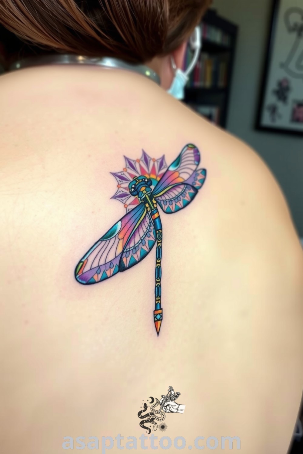 Stylish mandala dragonfly tattoo with vibrant blue and purple gradient colors, showcasing detailed linework and shading. A gorgeous tattoo idea you must see to believe. asaptattoo.com