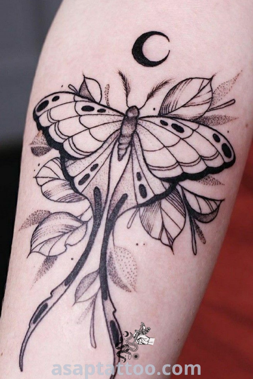 Elegant black and white luna moth tattoo on the right arm with a crescent moon, showcasing realistic detailing. A beautiful choice for tattoos that inspire and have meaning. Discover amazing tattoo ideas at asaptattoo.com.