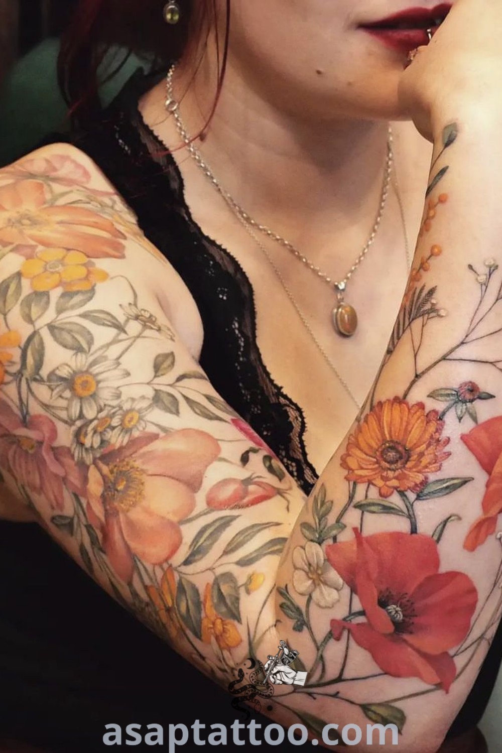 Vintage floral sleeve tattoo showcasing wildflowers, vibrant colors, and intricate designs. Perfect for women seeking elegant upper arm tattoos. Discover more at asaptattoo.com.