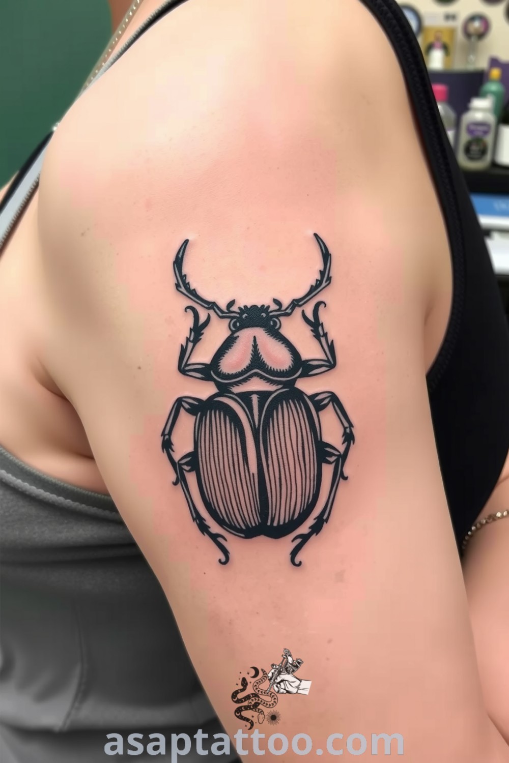 Monochrome beetle tattoo showcasing intricate linework with rich black ink and gradients enhancing its detail. A gorgeous tattoo idea that radiates strength and transformation you must see. asaptattoo.com