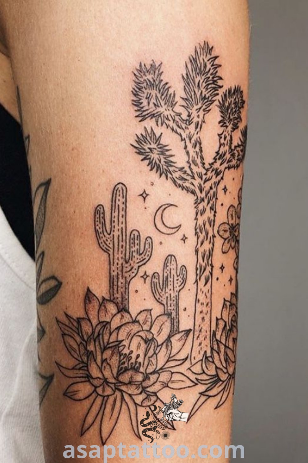 Cactus and flowers tattoo on the arm showcasing elegant design and artistic features. A popular choice for desert tattoos, inspiring ideas for tattoos to decorate your body with. Find more at asaptattoo.com.