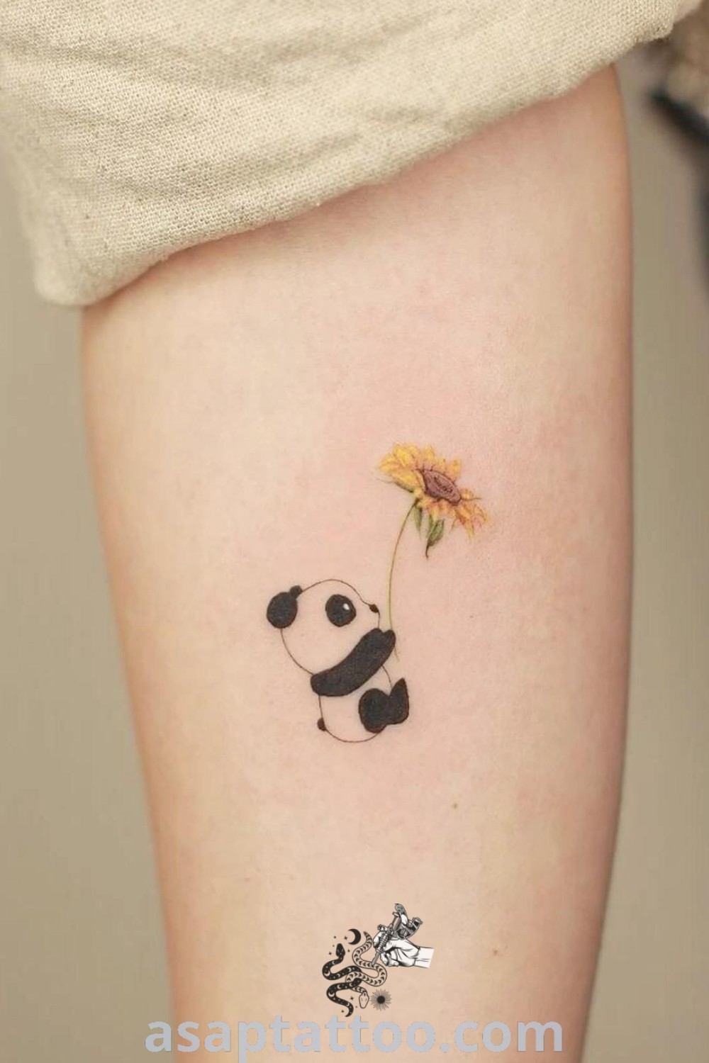 Cute panda sunflower tattoo featuring vibrant colors and artistic details, a perfect choice for women seeking small and cute animal tattoos. Explore more ideas to inspire you at asaptattoo.com.