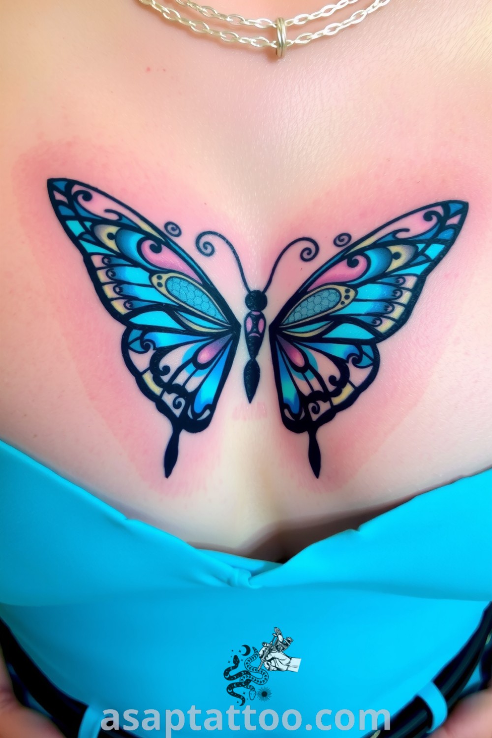 Ornamental butterfly tattoo with intricate linework, deep blue and purple gradient, and additional details, showcasing a design that will inspire you to get inked. asaptattoo.com