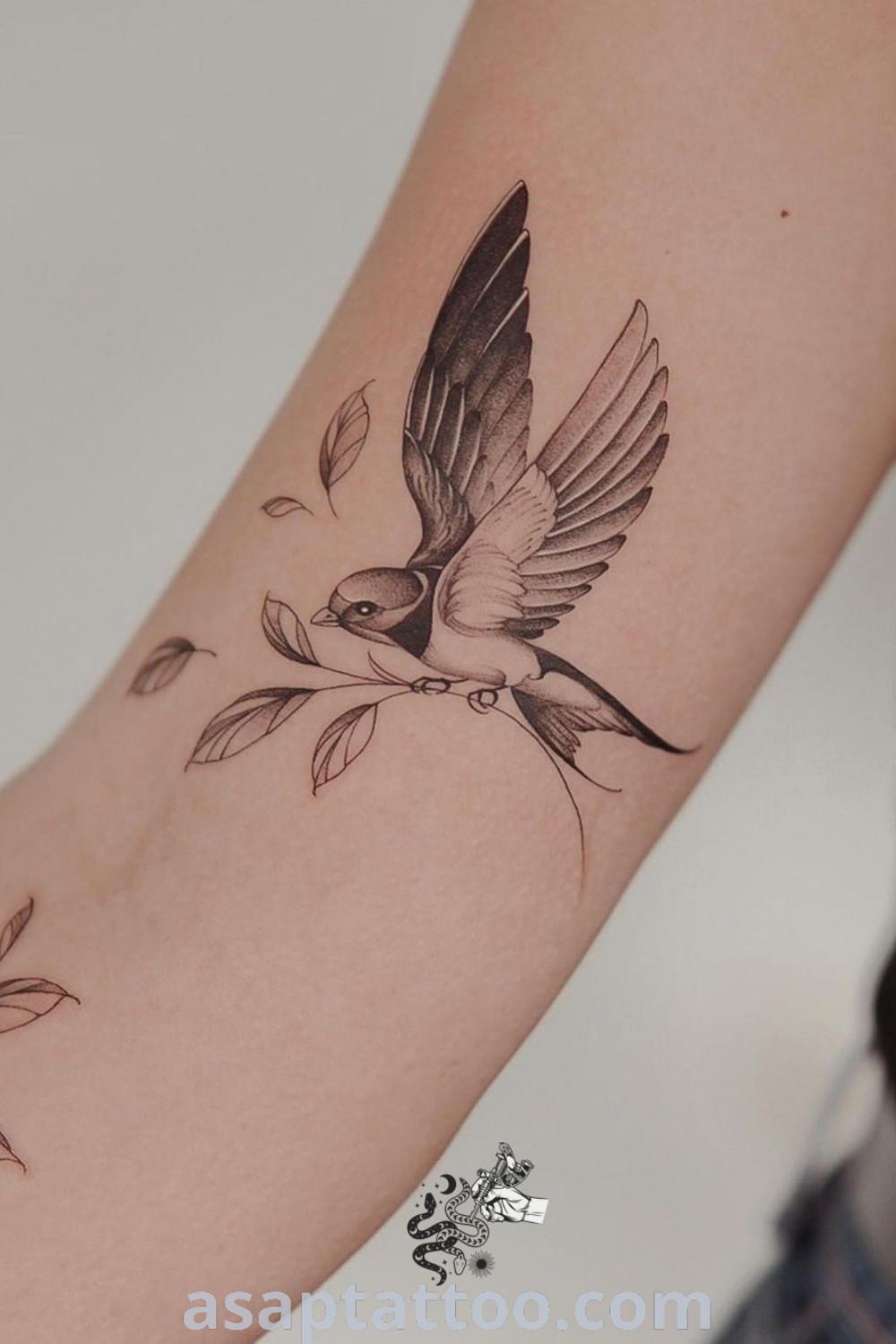Small bird tattoo on the arm featuring elegant sparrow or hummingbird designs, perfect for women seeking animal tattoos that inspire. Discover amazing tattoo ideas at asaptattoo.com.