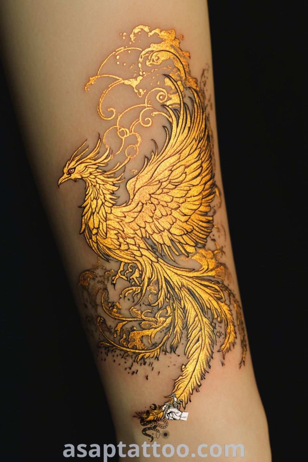 Molten gold phoenix tattoo featuring intricate design and vibrant hues of gold and amber, symbolizing rebirth and resilience. An elegant tattoo idea you must see to believe. asaptattoo.com