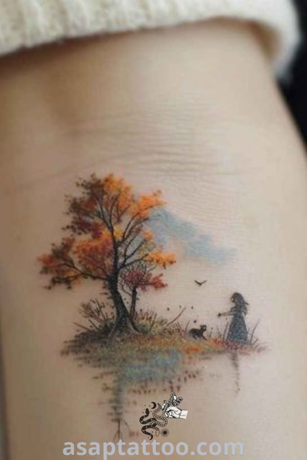 Stunning fall tree tattoo featuring beautiful autumn colors and intricate details, perfect for women seeking elegant body art. Discover inspiring autumn tattoo ideas at asaptattoo.com.