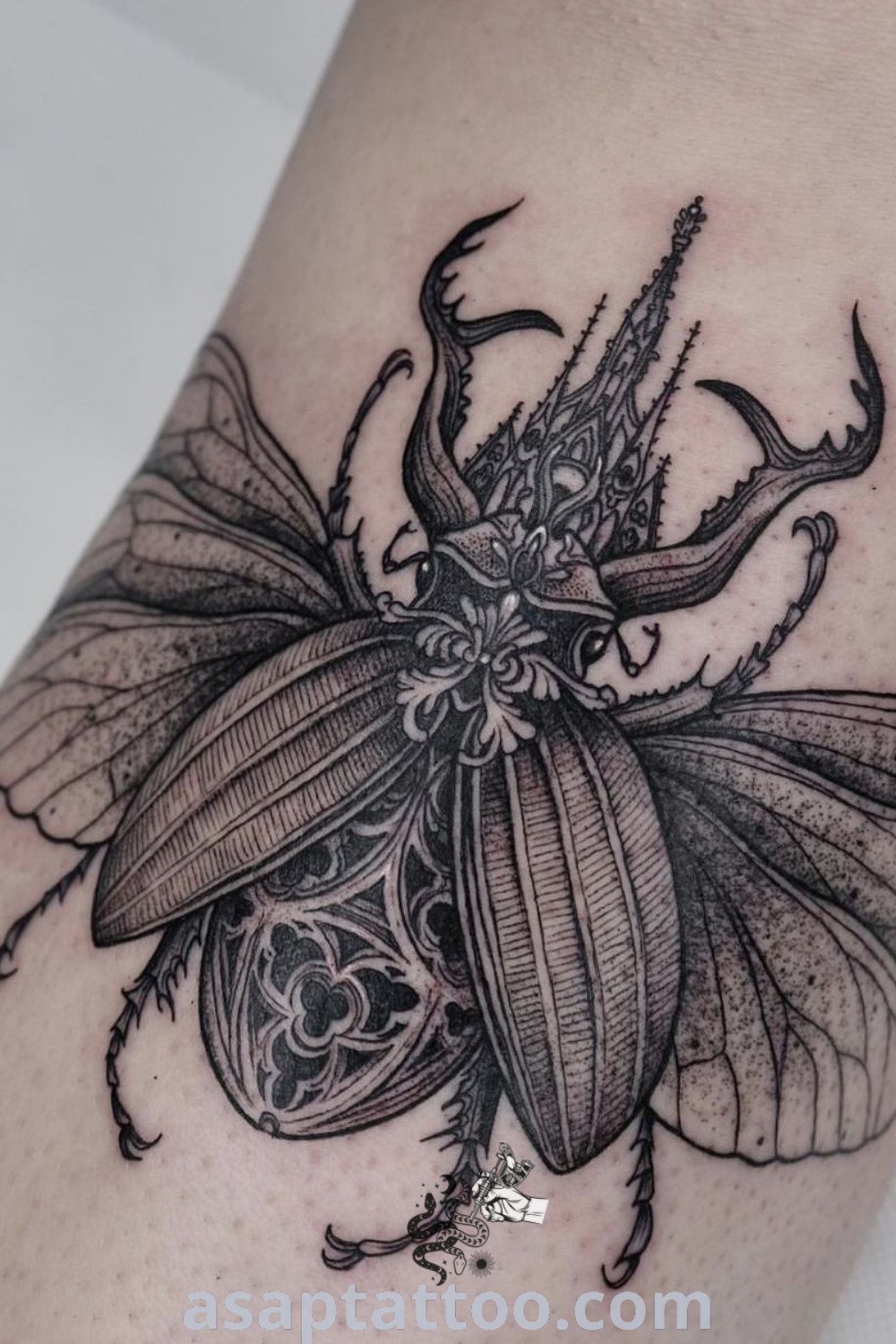 Black and white tattoo of a bug on the leg with intricate design, showcasing beetle, caterpillar, and cicada elements. A beautiful choice for elegant body art lovers. Discover more inspiring tattoo ideas at asaptattoo.com.