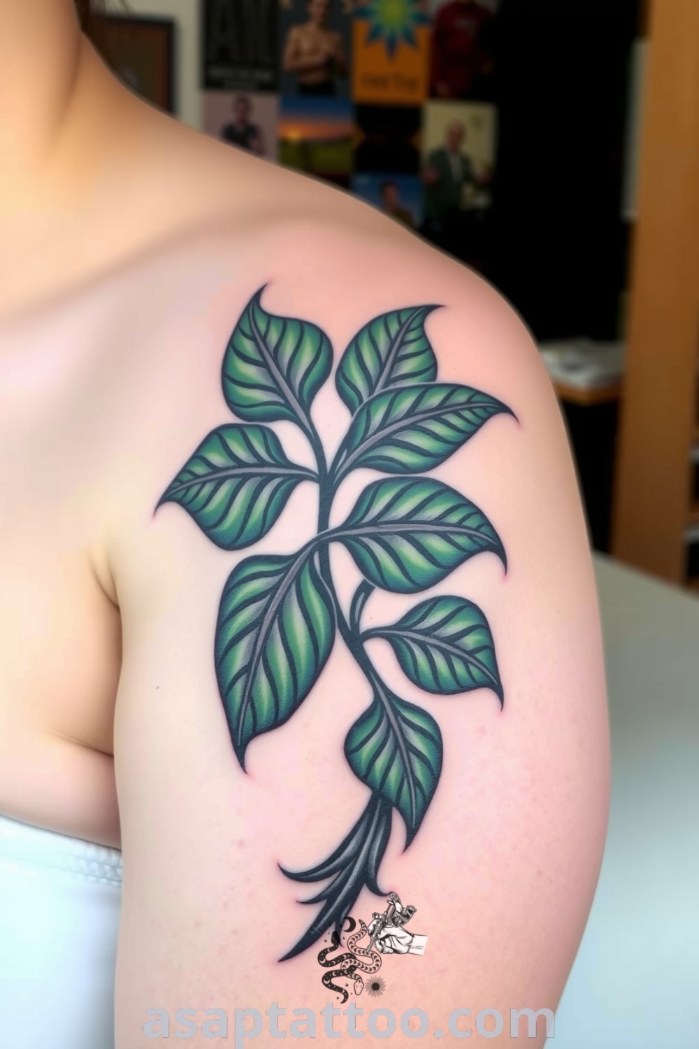 Tribal plants tattoo on upper arm featuring bold, sweeping lines and shades of deep green and black. A gorgeous design that will inspire you to get inked. asaptattoo.com