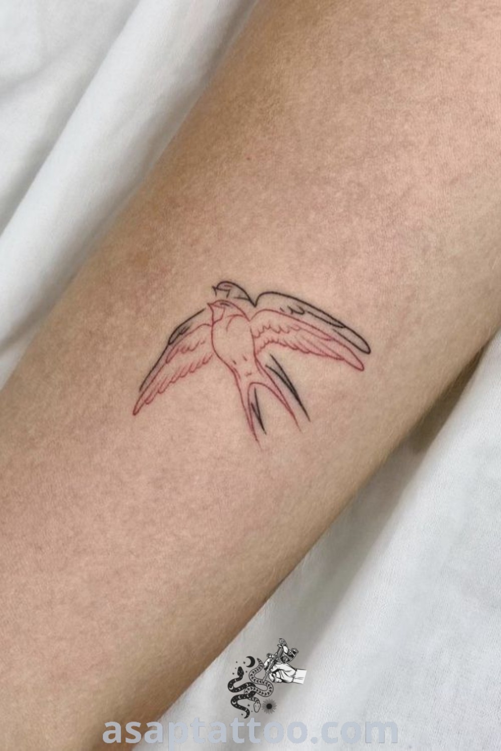 Elegant small bird tattoo of a robin on the arm, showcasing subtle and classy design elements. A stunning choice for dainty and discreet tattoos that inspire personal expression. Explore more ideas at asaptattoo.com.