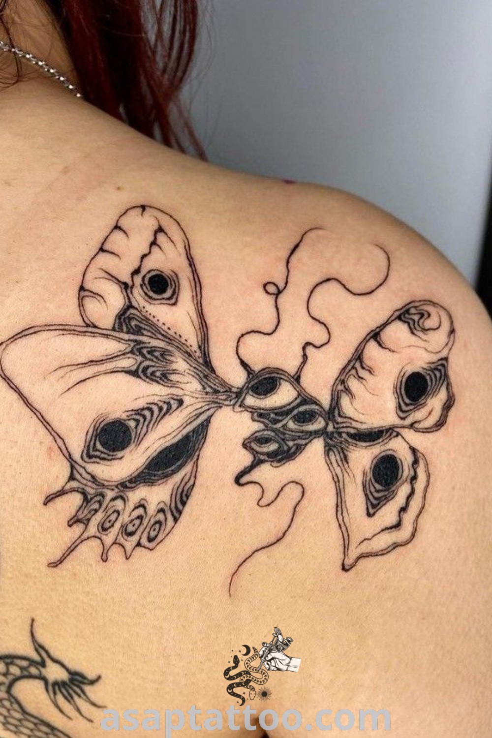 A woman with a butterfly tattoo on her back featuring a funky and elegant design. Perfect for those seeking cute and inspiring tattoos to decorate their body with. Discover the best ideas at asaptattoo.com.
