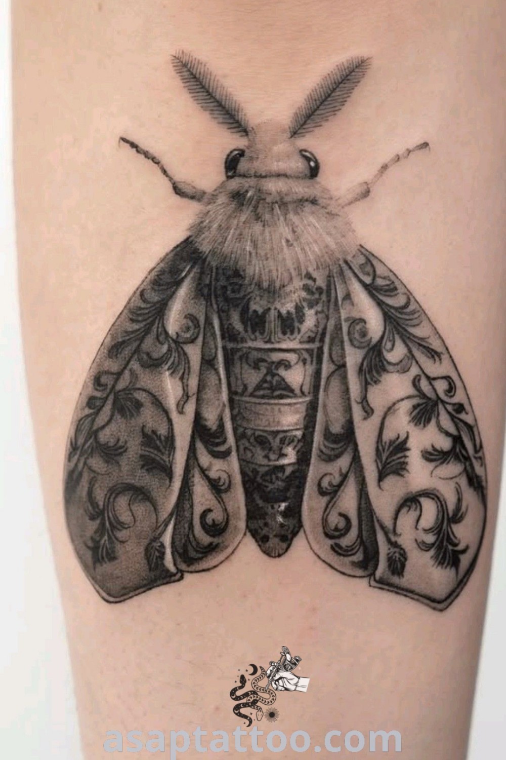 Black and white butterfly tattoo on the thigh with intricate design, perfect for insect tattoo lovers. Discover stylish tattoo inspiration and ideas at asaptattoo.com.