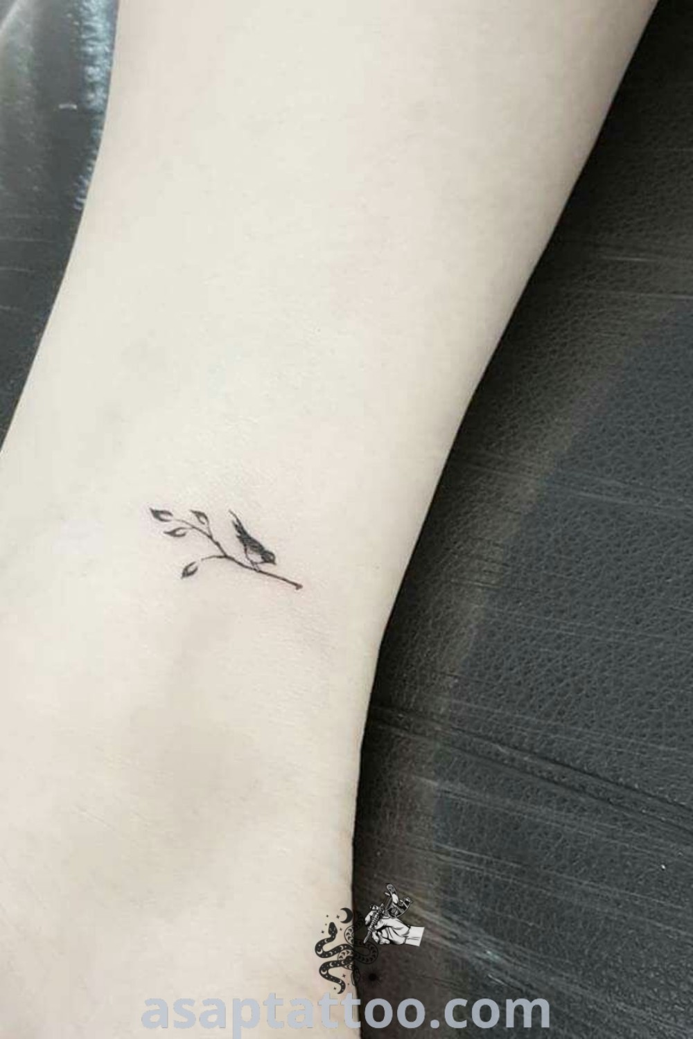 Dainty small flower tattoo on ankle, including designs like tiny robin, small wren bird, and mini bird tattoos for women, offering amazing inspiration for tattoos to decorate your body with. Discover more at asaptattoo.com.