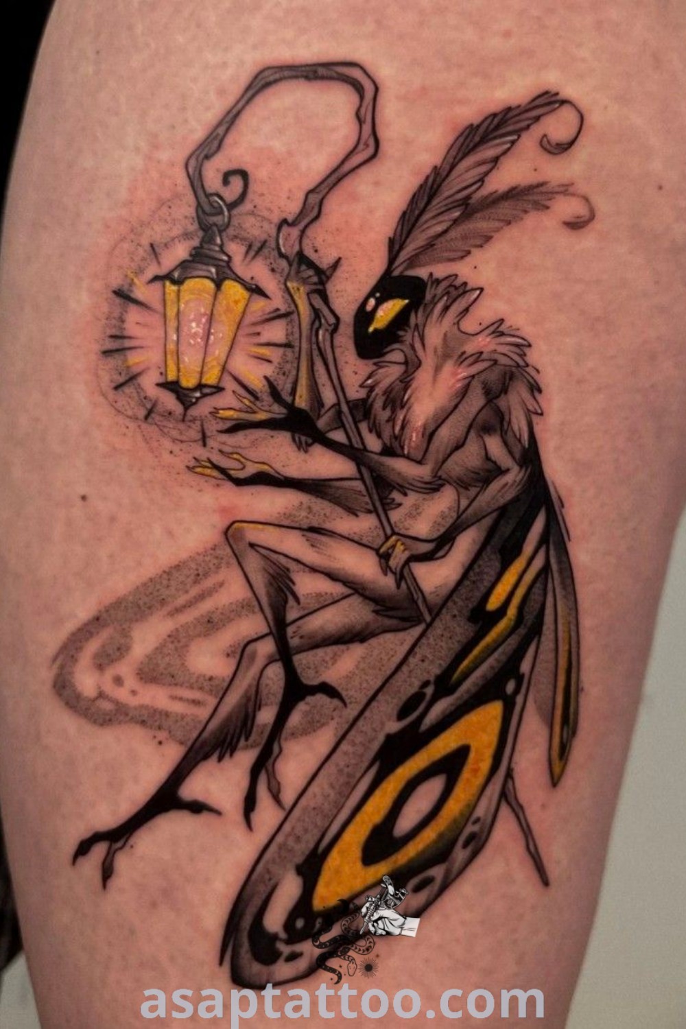 Moth and lamp tattoo on a man