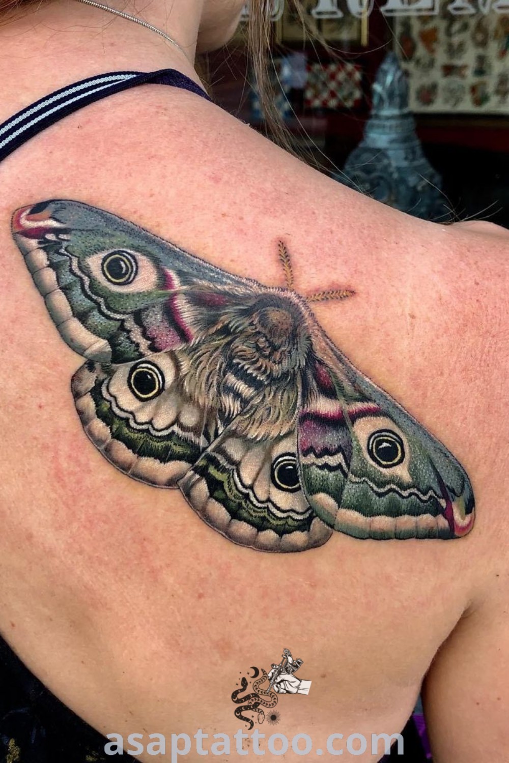 Vintage butterfly tattoo on a woman