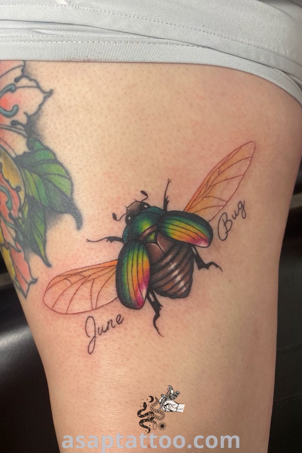 Colorful June Bug tattoo on woman
