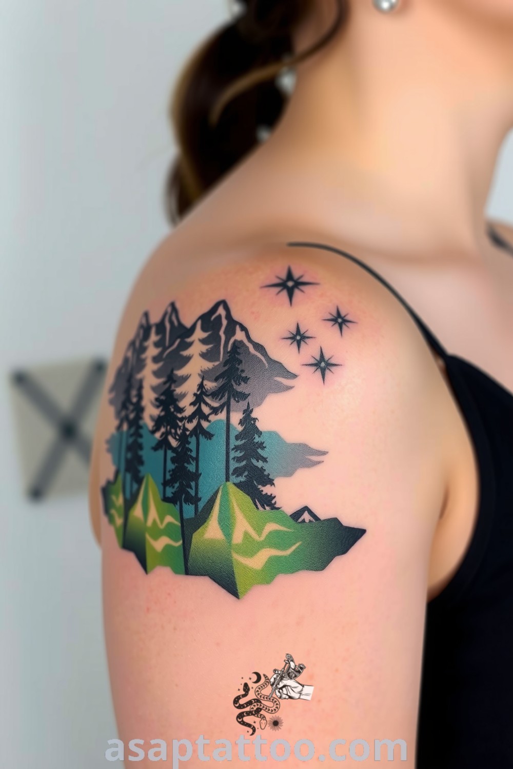 Abstract forest and mountain tattoo featuring intricate linework and gradients of green and gray, beautifully blending into the skin. A gorgeous tattoo idea you must see. asaptattoo.com