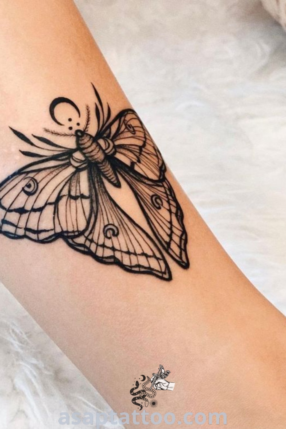 Small butterfly tattoo resembling a moth on the right arm and leg, showcasing elegant wings and botanical line art. Ideal for tattoo lovers looking for feminine designs and inspiring tattoo ideas. Visit asaptattoo.com for more information.