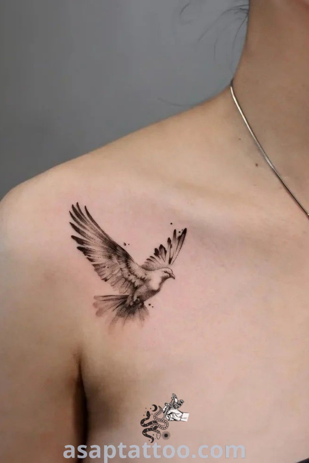 Elegant small bird tattoo on the left side of a woman’s chest, representing freedom and beauty. Discover amazing dove tattoo ideas and collarbone bird tattoos that will inspire you to get inked. Find gorgeous designs at asaptattoo.com.