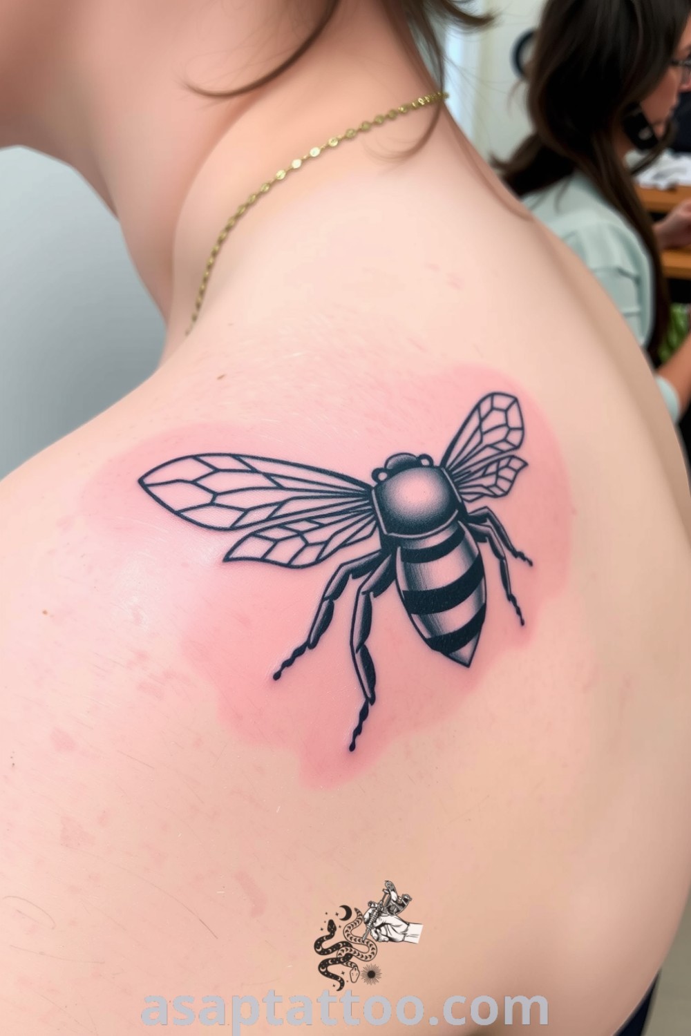 Intricate blackwork bee tattoo with detailed wings and body, showcasing depth and realism in rich ink saturation. An amazing tattoo idea you must see to believe. asaptattoo.com
