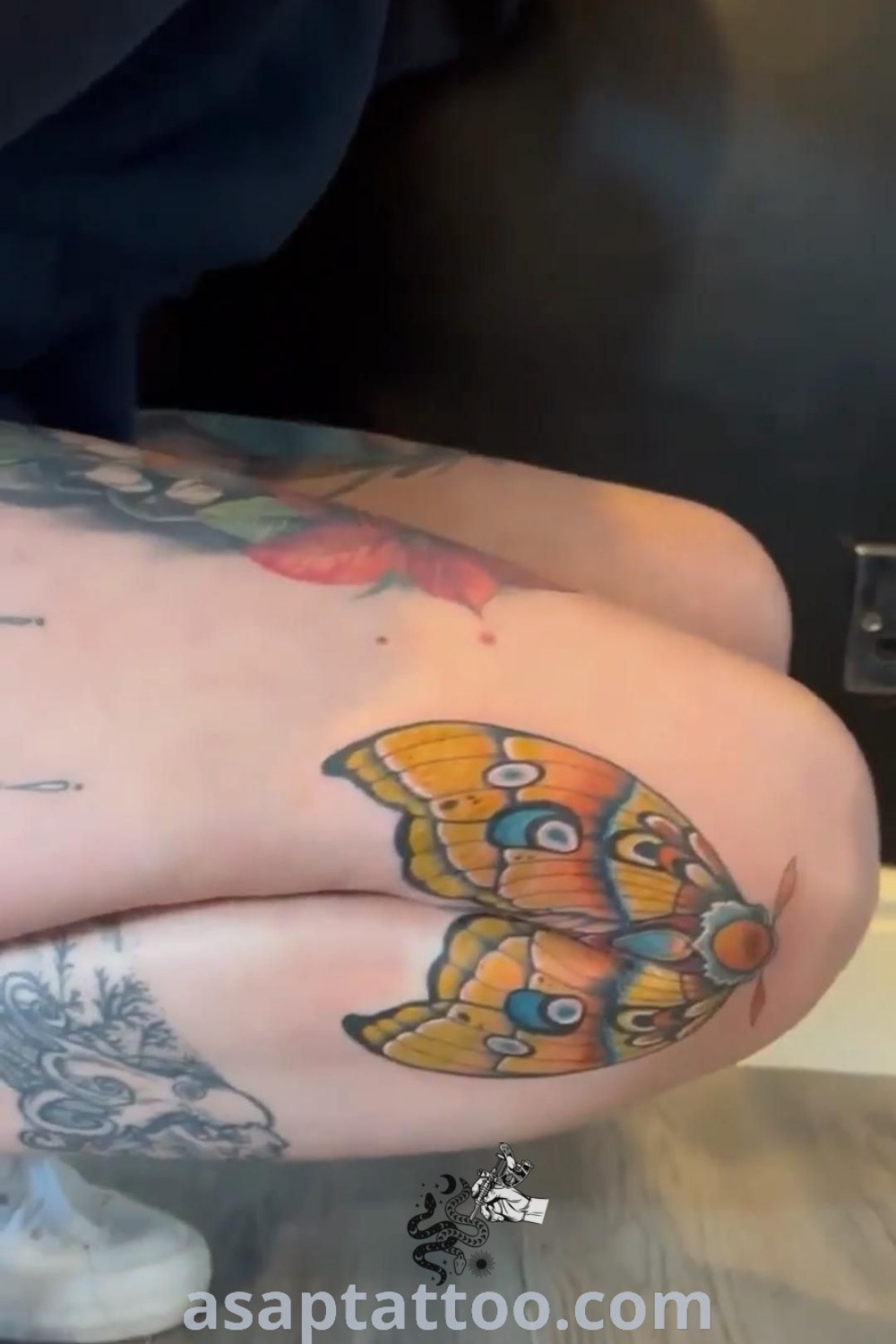 Elegant knee bend tattoo showcasing beautiful butterfly and bull skull designs. Discover inspiring tattoos to try right now at asaptattoo.com.