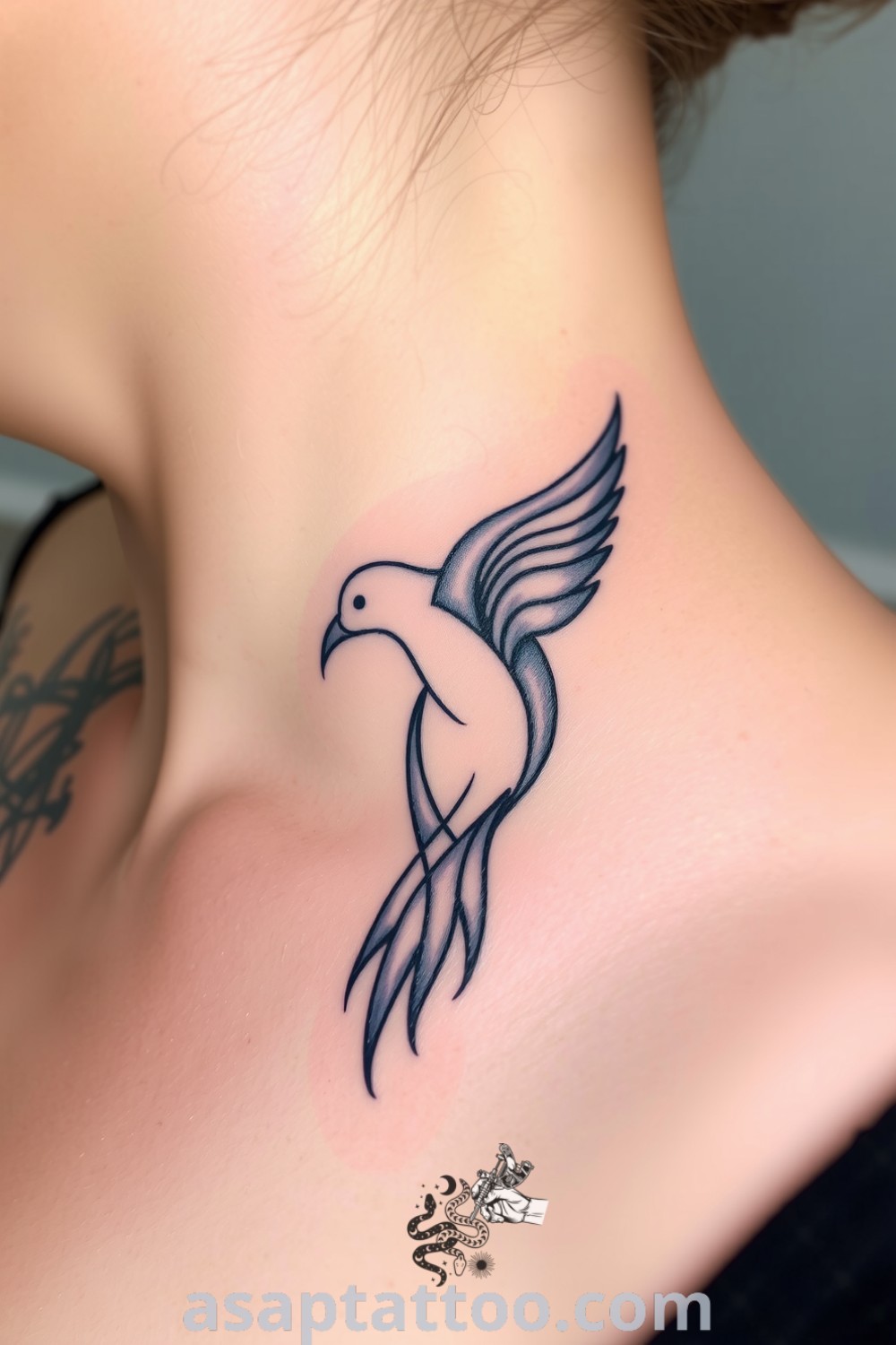 Abstract bird tattoo on collarbone with flowing lines and intricate gradients of deep blue and soft gray. A gorgeous tattoo that symbolizes beauty and freedom, inspiring you to get inked. asaptattoo.com