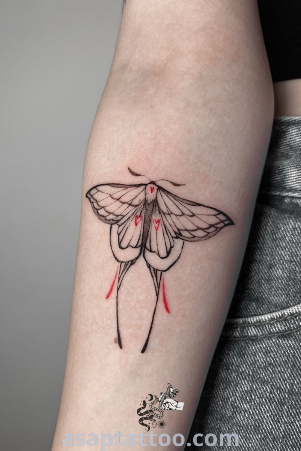 Small lunar moth tattoo on the left arm, showcasing elegant graphic design. A perfect choice for those seeking unique tattoos to decorate their body with. Explore more inspiring tattoo ideas at asaptattoo.com.