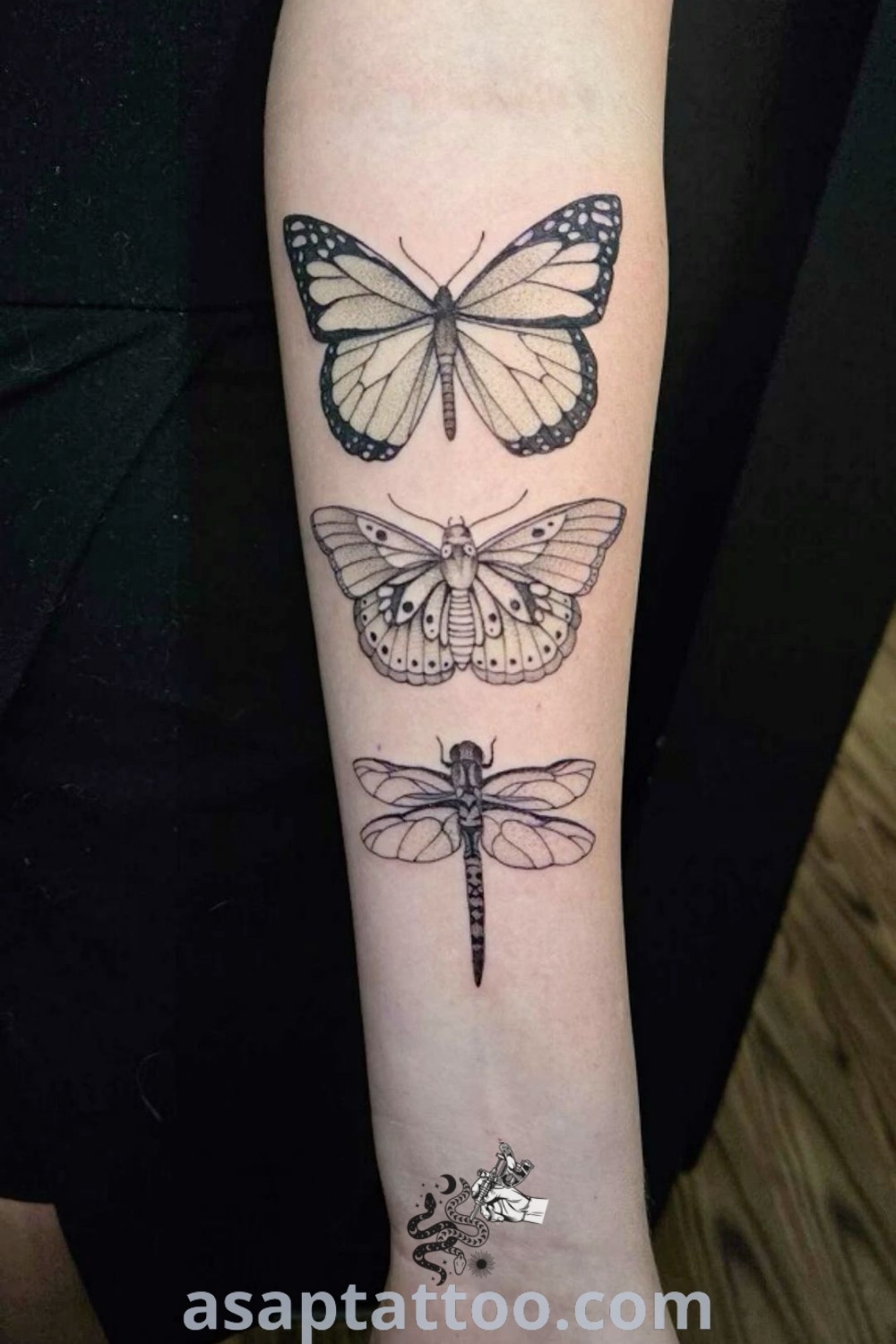 Elegant moth sleeve tattoo on a woman