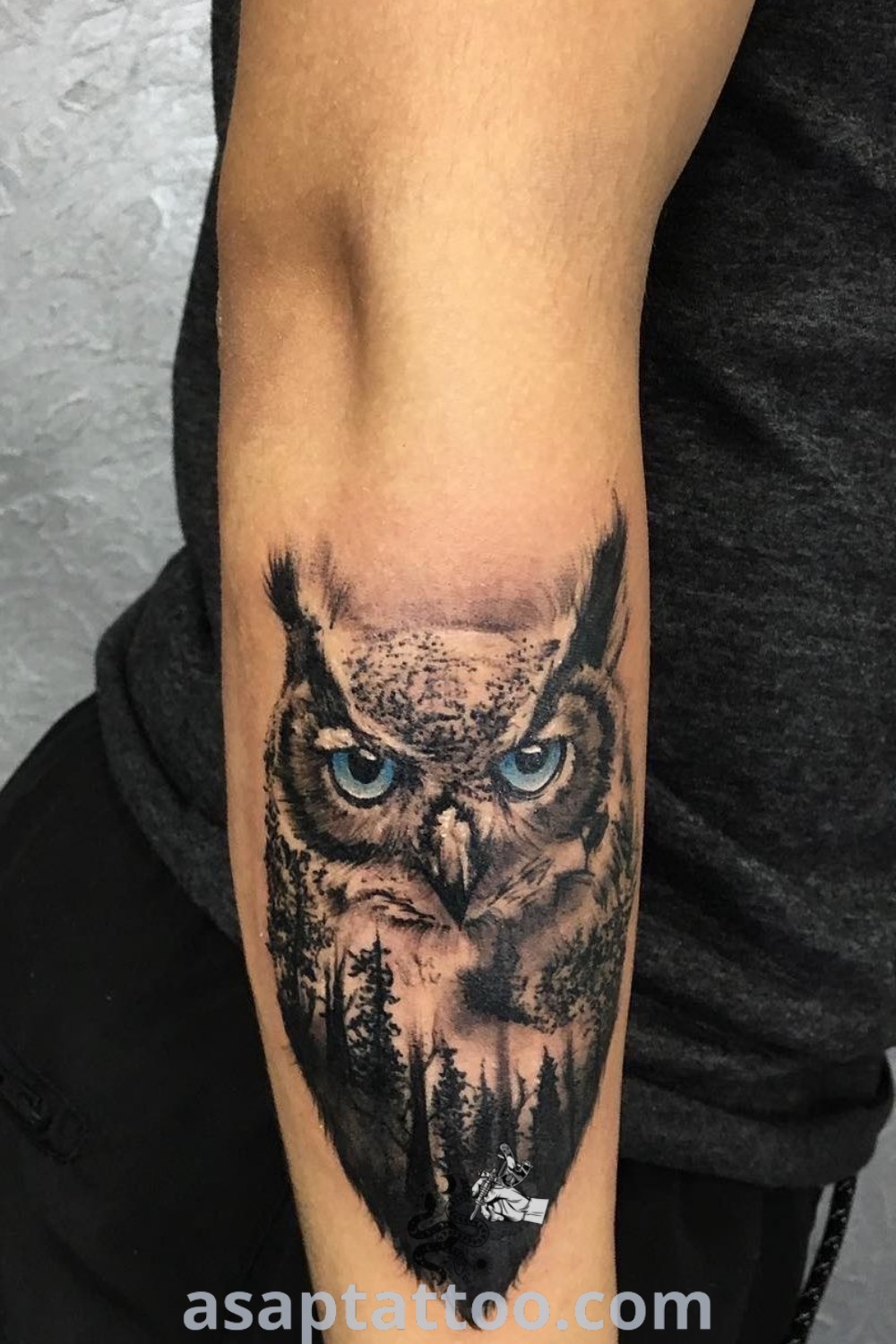 An owl with blue eyes tattoo on the arm, showcasing owl tattoos for men and women, simple and unique designs, capturing nature