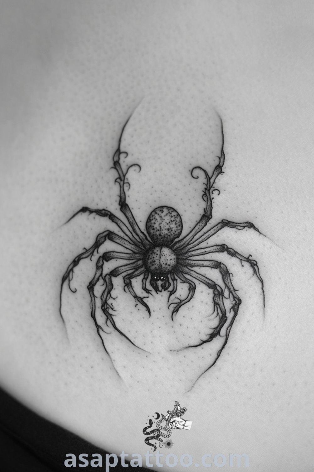 Gothic spider tattoo on the chest with intricate linework and shading for realistic depth. An elegant tattoo design that will inspire you to get inked. asaptattoo.com