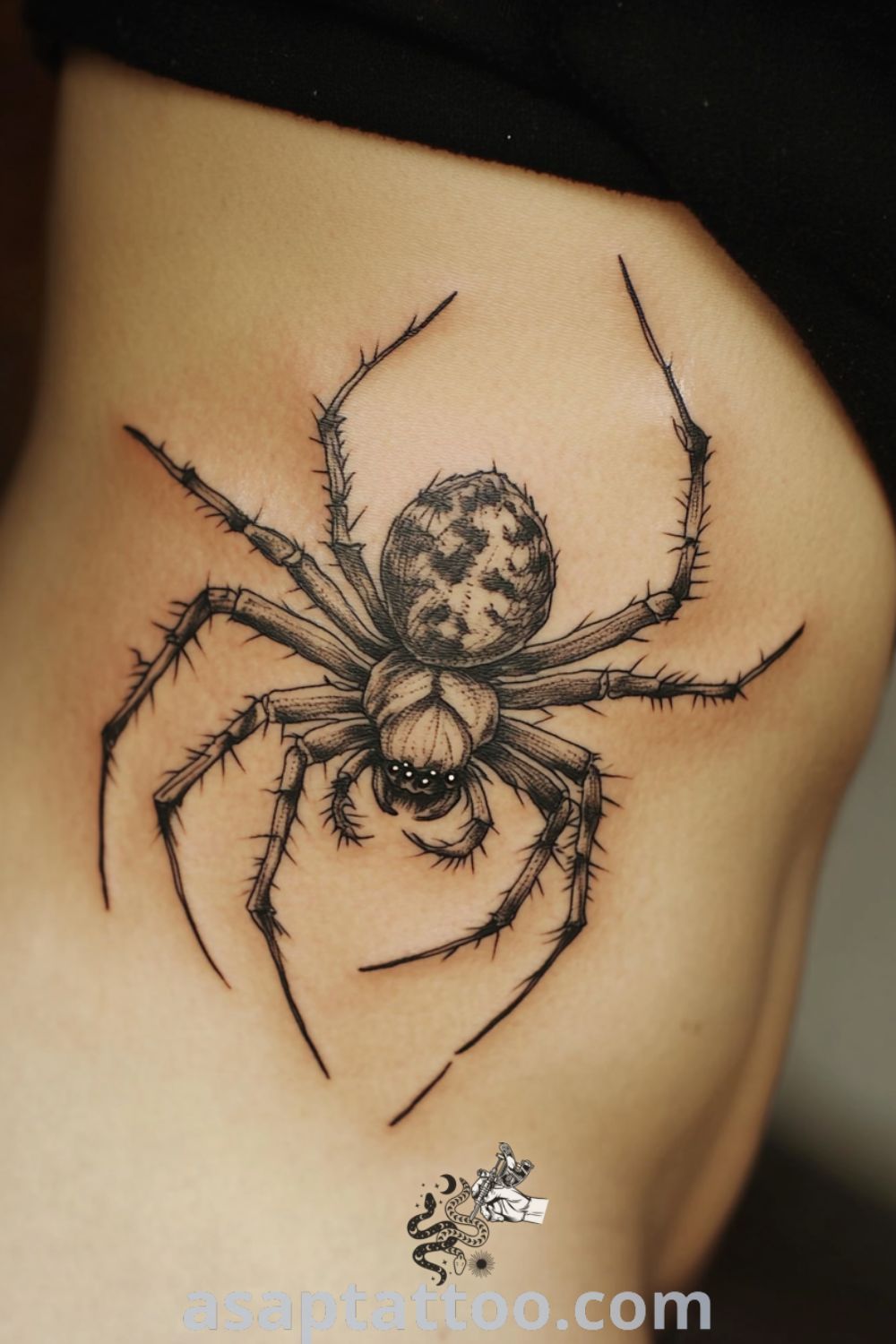 Vintage spider tattoo with intricate linework and glossy black ink, symbolizing resilience and transformation, showcasing amazing tattoo ideas you must see. asaptattoo.com