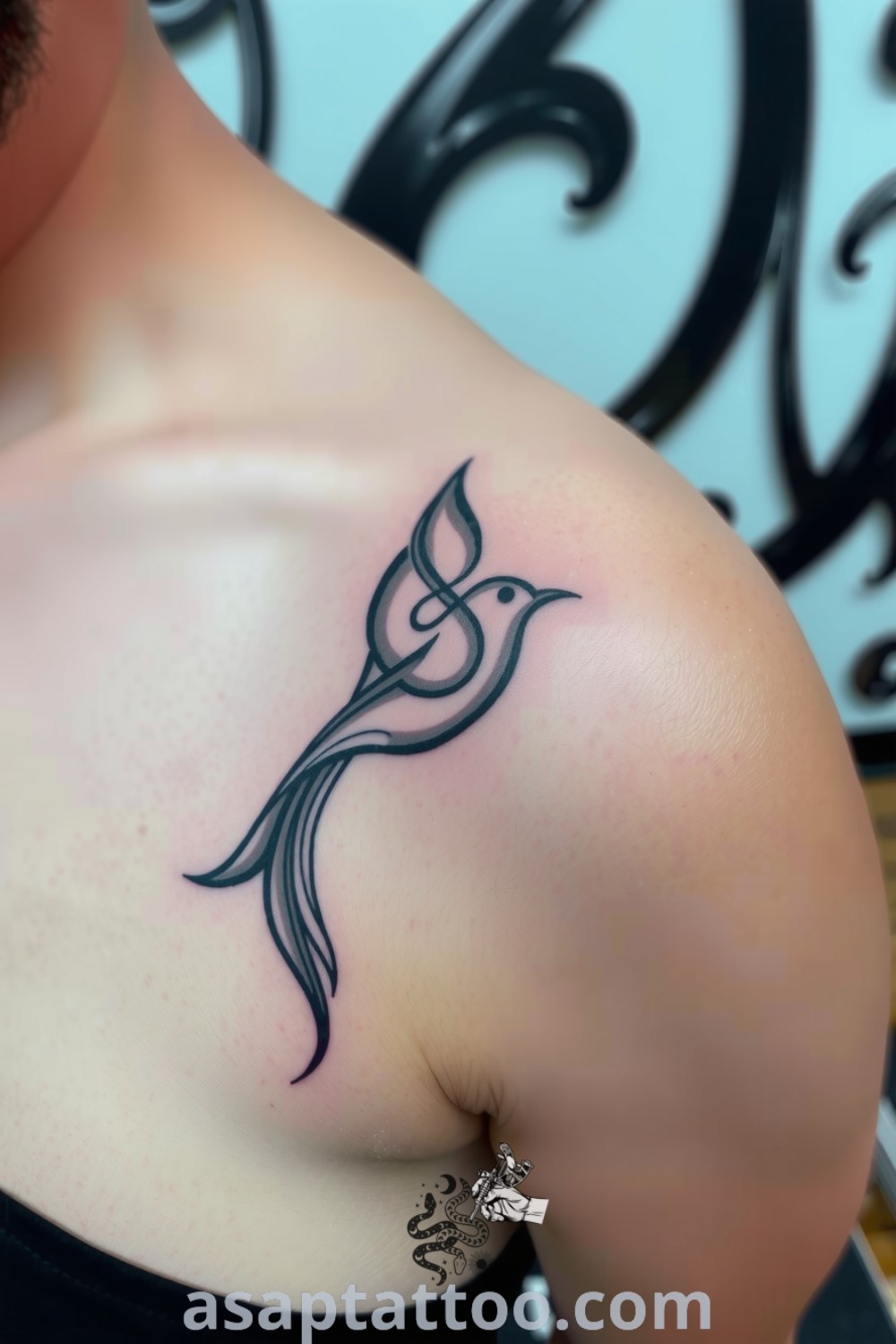 Elegant abstract bird tattoo with flowing lines and graceful curves in rich blacks and soft grays. This stunning design captures the spirit of freedom, making it one of the best tattoo ideas you must see to believe. asaptattoo.com