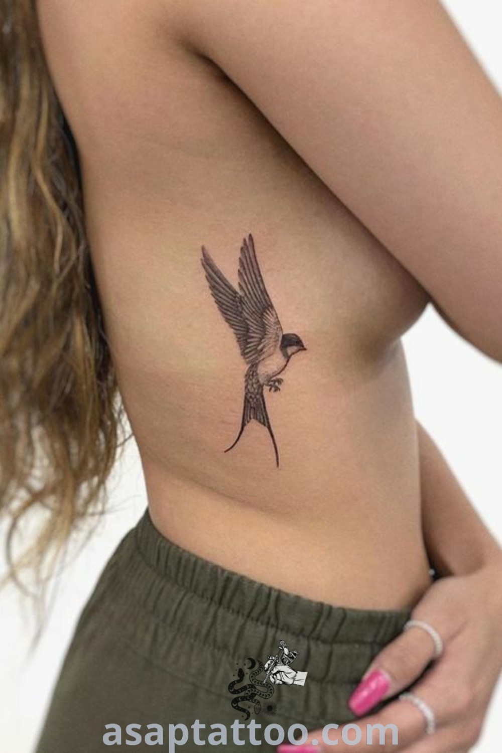 Elegant swallow bird tattoo on a woman