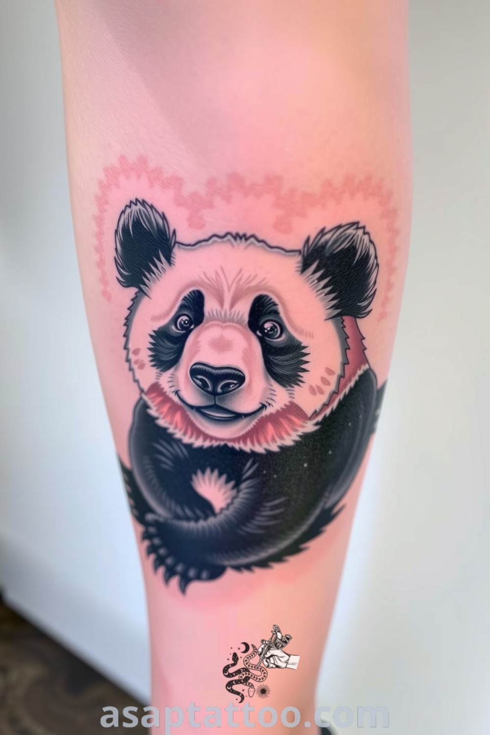 Realistic panda tattoo on the calf with detailed fur in black and white, showcasing a gentle expression. An amazing tattoo idea you must see to believe. asaptattoo.com