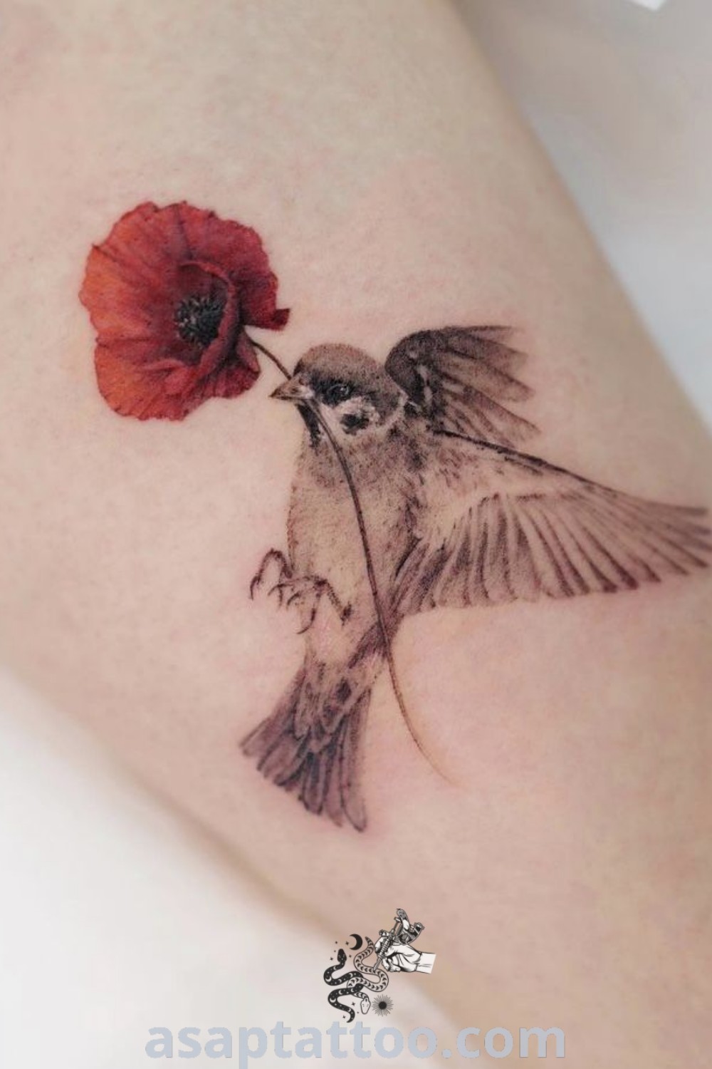 Charming bird tattoo holding a flower with spread wings, inspired by tiny bird and poppy tattoos. A perfect design for those exploring elegant tattoos. Discover more amazing ideas at asaptattoo.com.