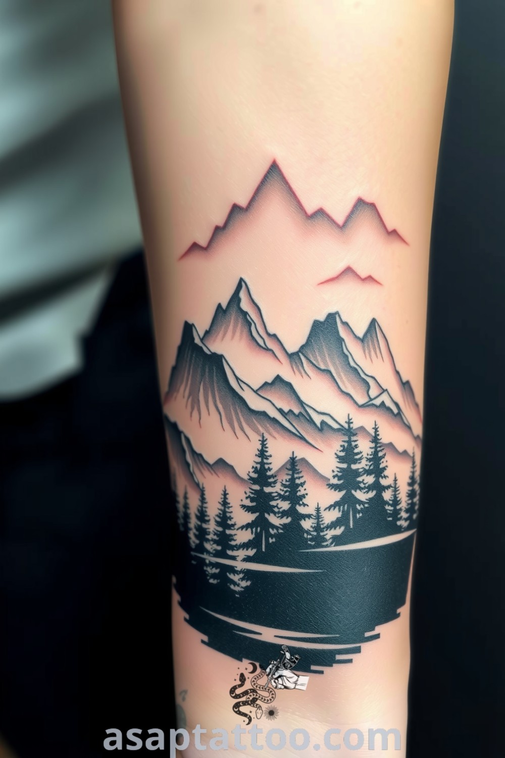 Realistic tattoo of majestic mountains and a serene forest with intricate detailing and shading. A gorgeous tattoo idea you must see to believe for nature enthusiasts. asaptattoo.com