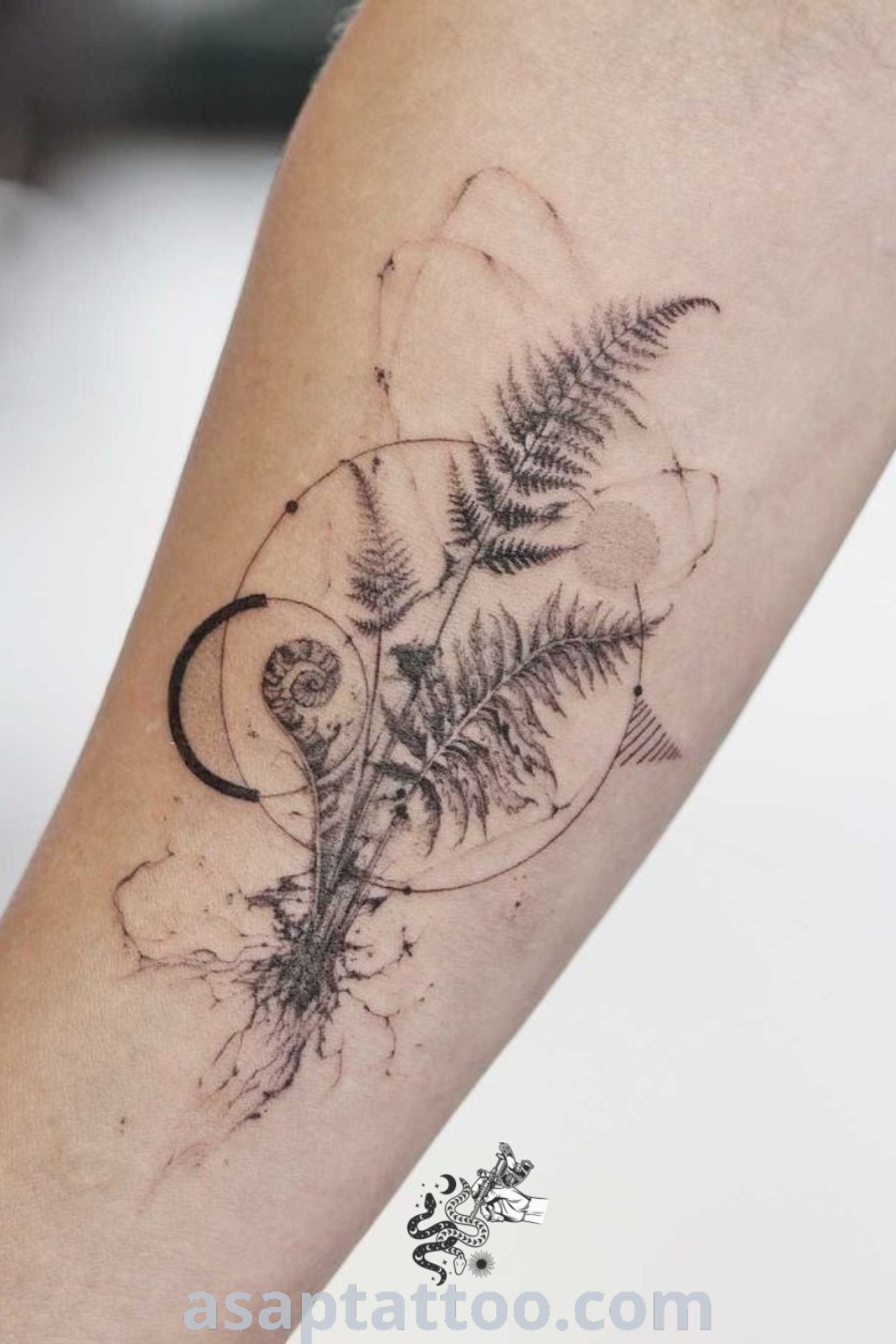 A geometric fern tattoo with a moon at its center, showcasing elegant botanical design elements. Perfect inspiration for plant tattoo lovers. Discover more amazing ideas at asaptattoo.com.