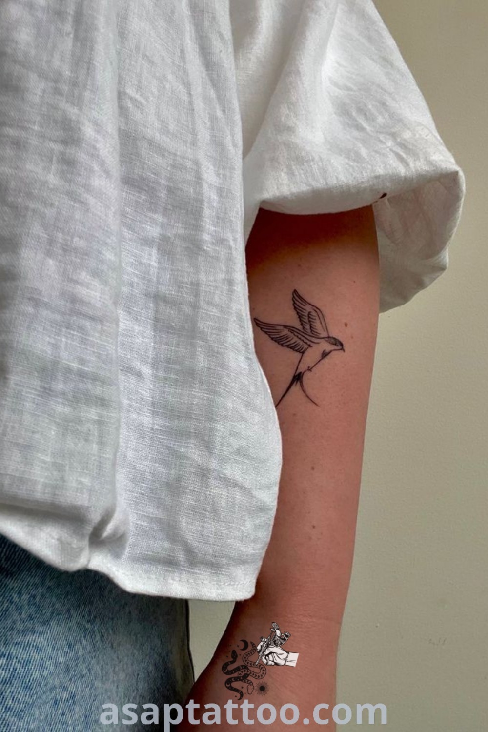 Small hummingbird tattoo on left arm showcasing fine line art, a beautiful choice for tattoo lovers seeking cute and elegant designs. Discover more inspiring ideas at asaptattoo.com.