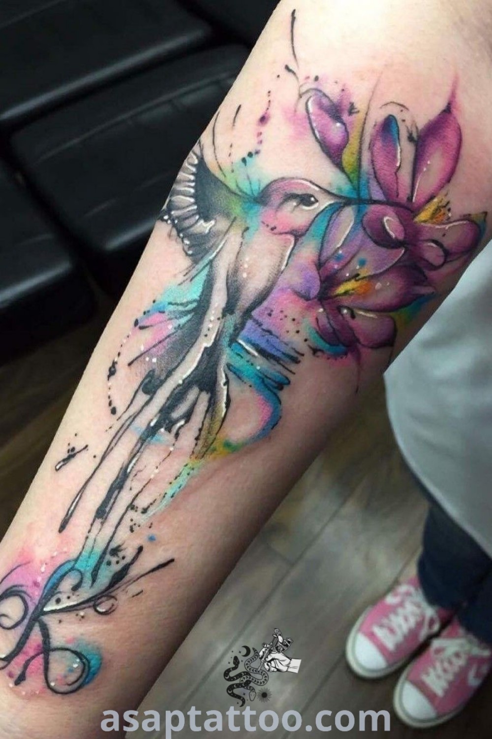 Watercolor bird tattoos on a woman