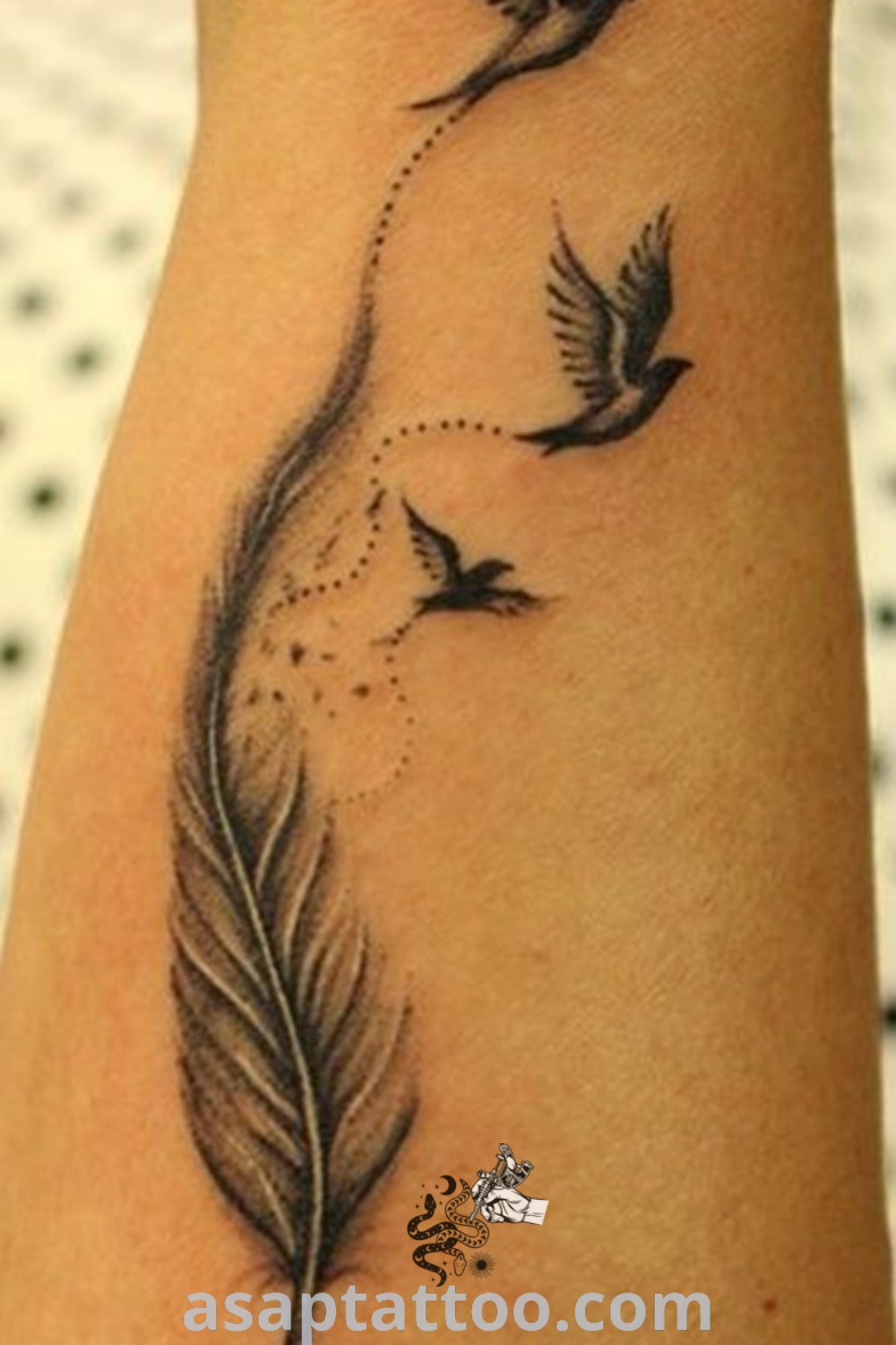 Elegant feather tattoo on a woman