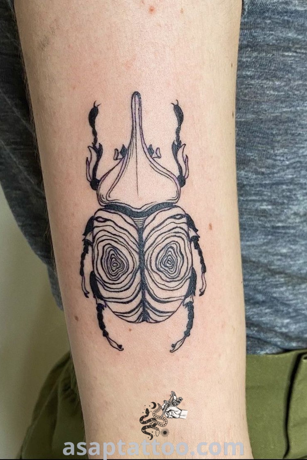 Beetle tattoo on left arm, featuring a detailed design ideal for nature sleeve and bug tattoo lovers. A perfect choice among amazing tattoos with meaning, discover more at asaptattoo.com.