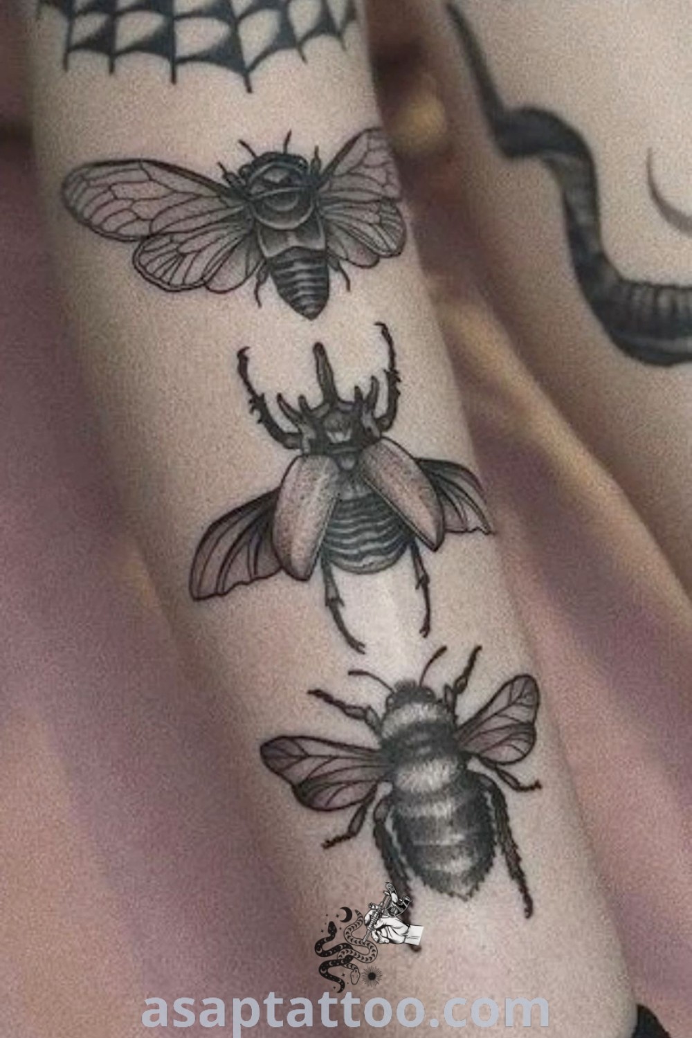 Tattoos on the legs of two women featuring piercing tattoo designs and watermelon ink. Inspiring body art ideas you will absolutely love, showcased on asaptattoo.com.