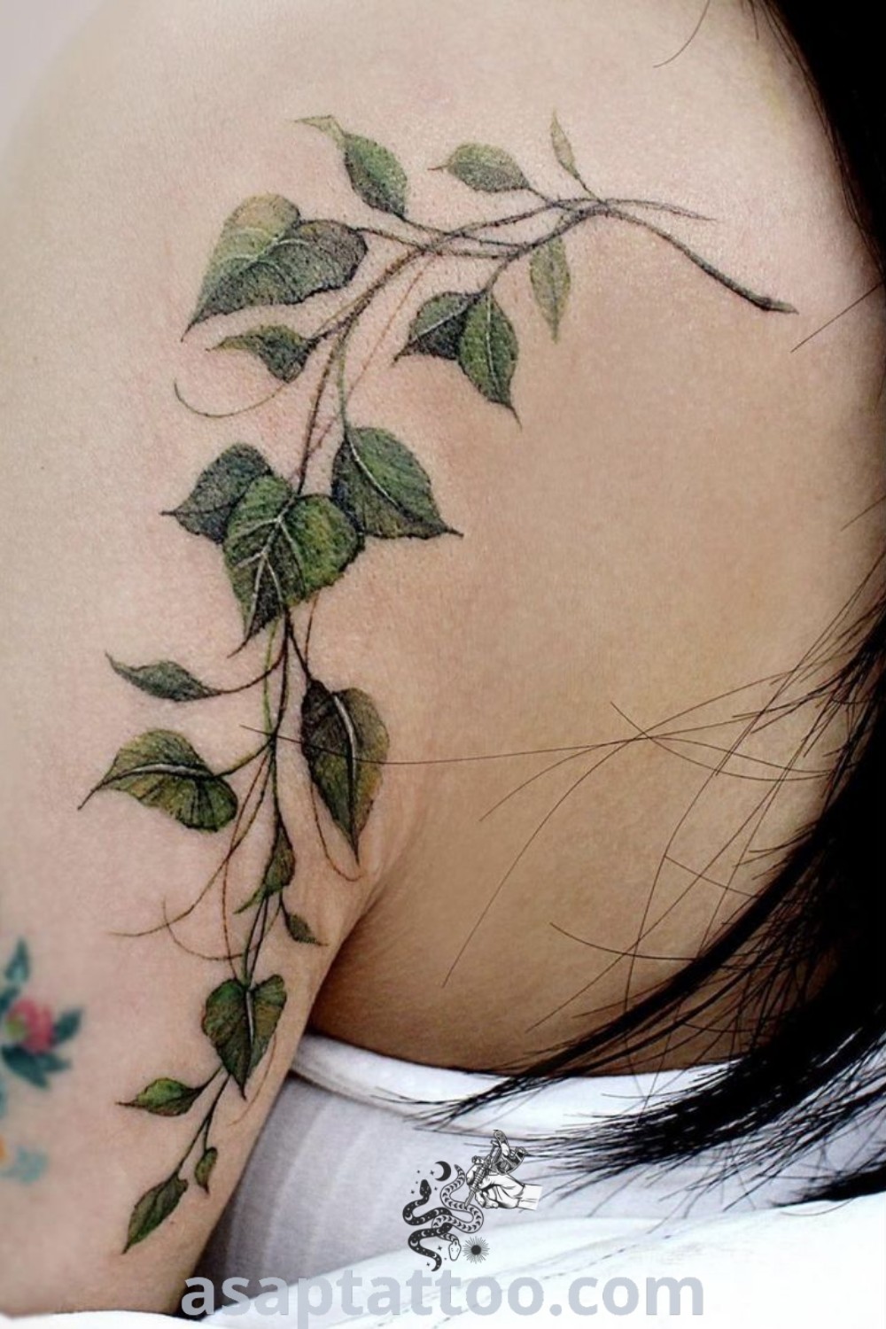 Ivy tattoo on the back of a woman