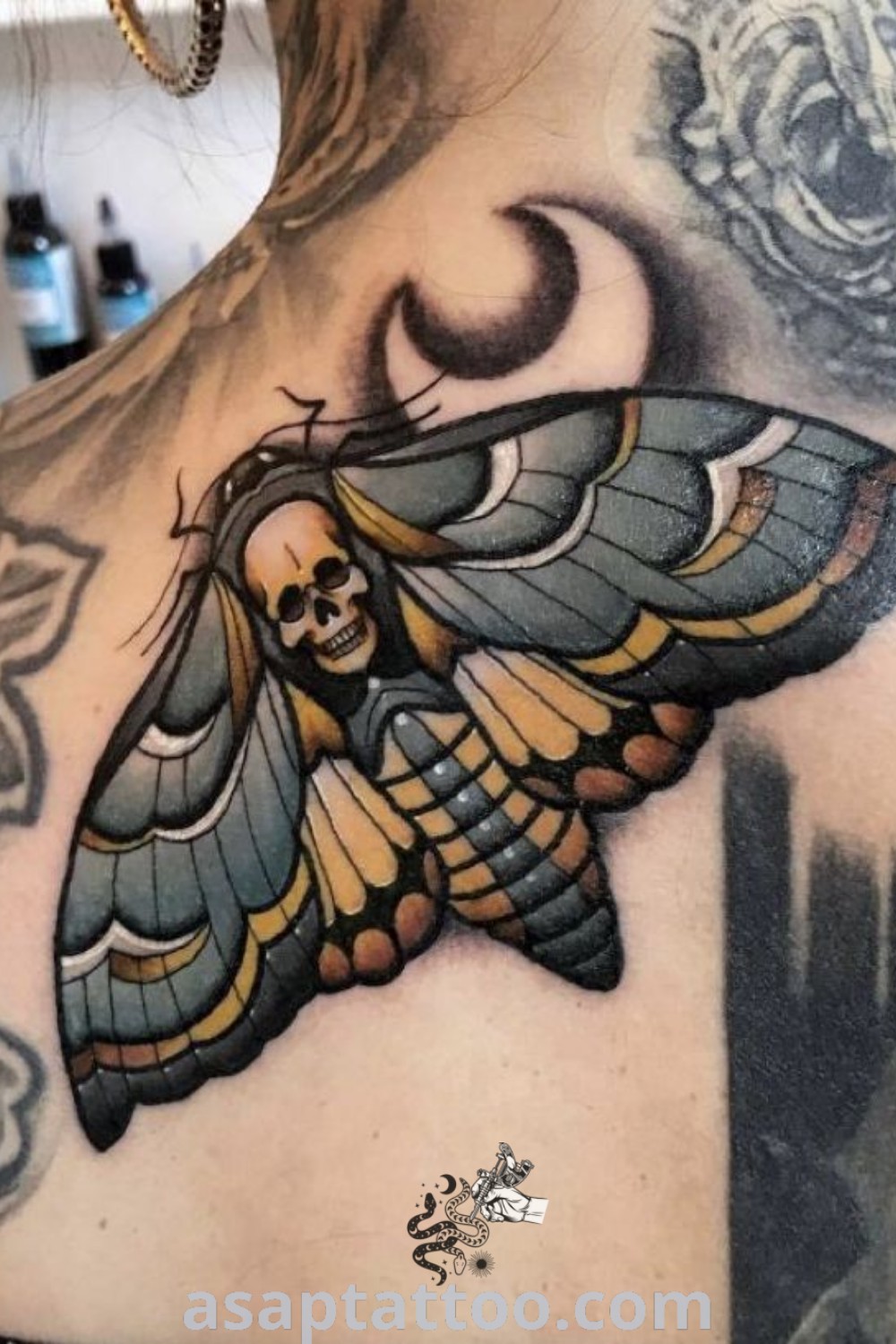 Stunning moth tattoo design displayed on a woman