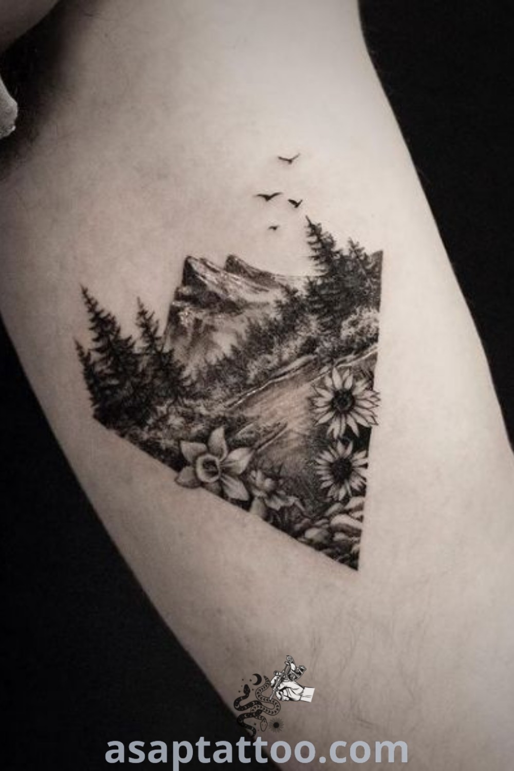 Black and white photo of a unique mountain tattoo design with flowers, showcasing amazing nature tattoos and wrist mountain tattoos for women. Get inspired and explore more at asaptattoo.com.