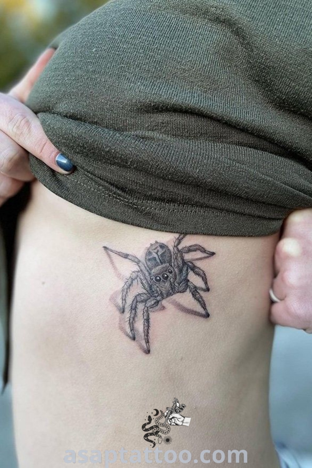 Cute jumping spider tattoo on a woman