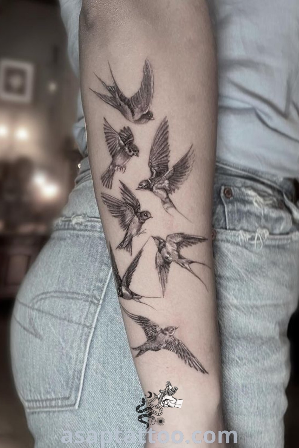 Charming love birds tattoo design symbolizing affection and togetherness, ideal for arm or forearm placement. Find the best ideas for meaningful tattoos at asaptattoo.com.